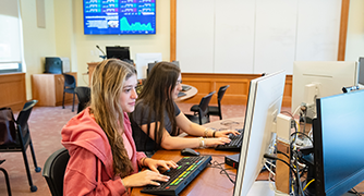 Image of two students working in the Investment Center