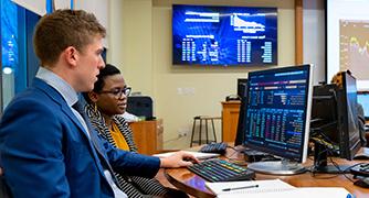 An image of business students in the Investment Center