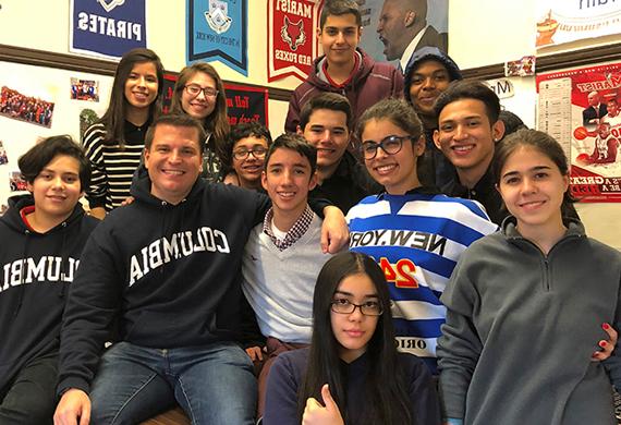 Image of Andrew Paulsen with his class of students